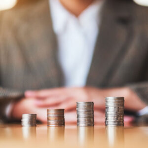 Stacks of coins representing investment growth in startup marketing strategies for attracting venture capital.
