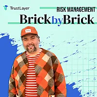 Man wearing a colorful patterned jacket and cap, featured in "Risk Management: Brick by Brick" podcast promotional image, highlighting construction risk management strategies.